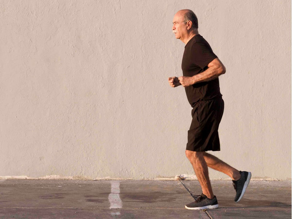 Older man jogging outdoors – when can I start running after hair transplantent?